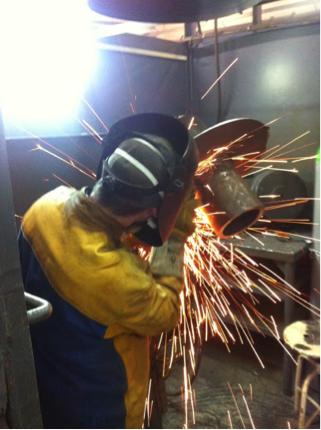 A welder during his training day welding a root pass